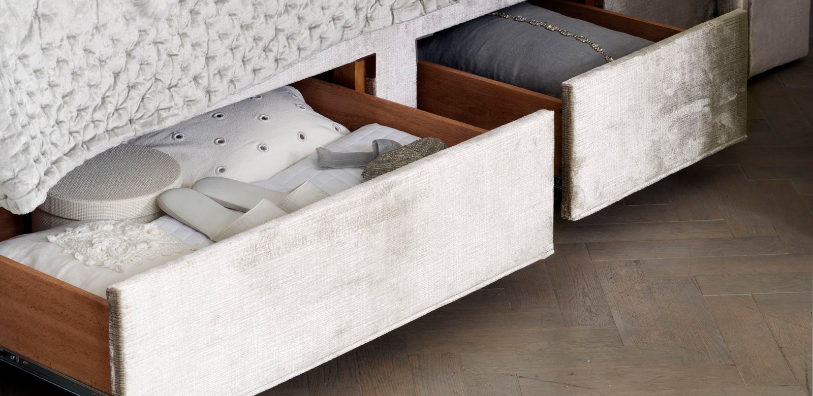 Hidden storage drawers inside the divan